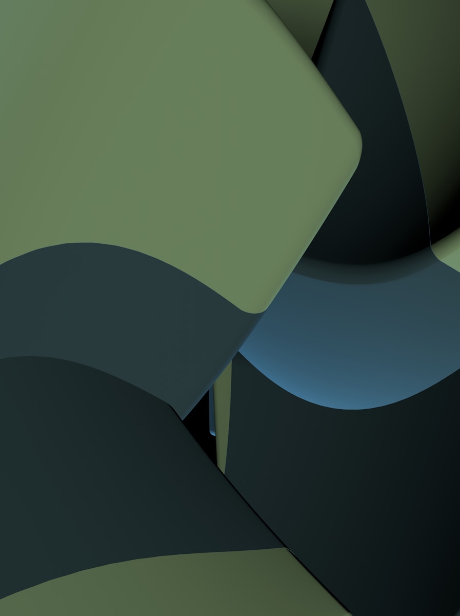 a green wall with a black chair