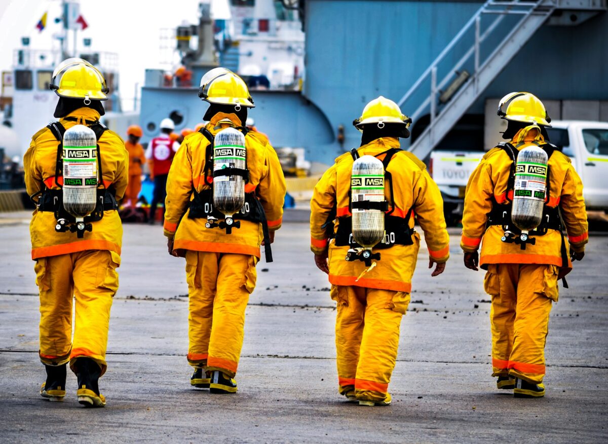 four yellow fire fighters