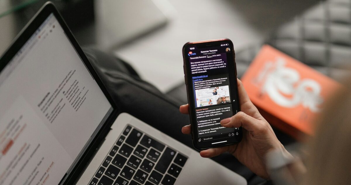 person holding black iphone 4