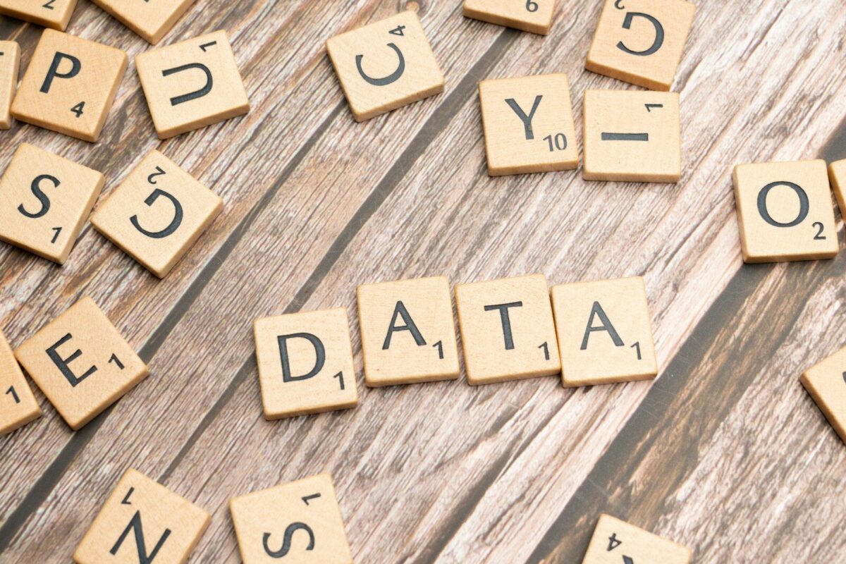 scrabble tiles spelling out the word data on a wooden surface